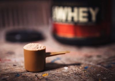 Close-up of protein powder in scoop on table