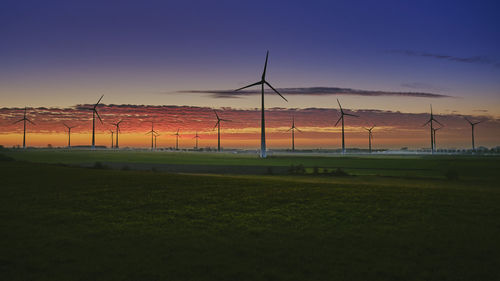 Scenic view of field against sky during sunset