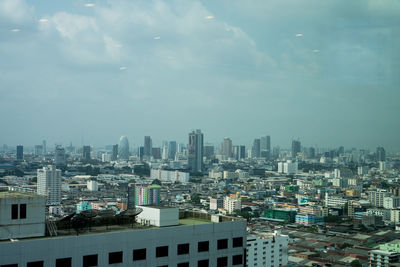 High angle view of buildings in city against sky