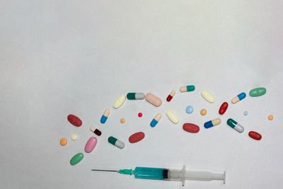 Multi colored pills on white background