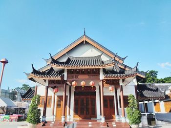 Facade of building against clear blue sky