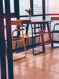 Empty chairs and tables in cafe