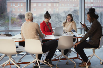 People having meeting in office