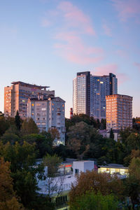 Buildings in city against sky