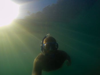 Low angle view of man snorkeling underwater