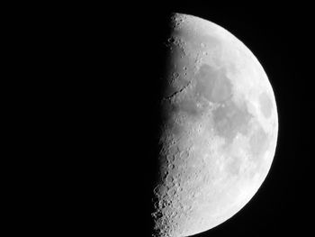 Low angle view of half moon against sky at night