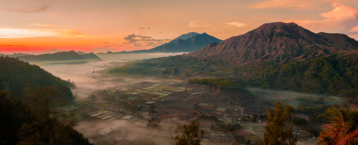 Scenic view of mountains against sky during sunset