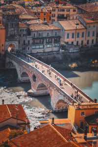 High angle view of bridge over river against buildings