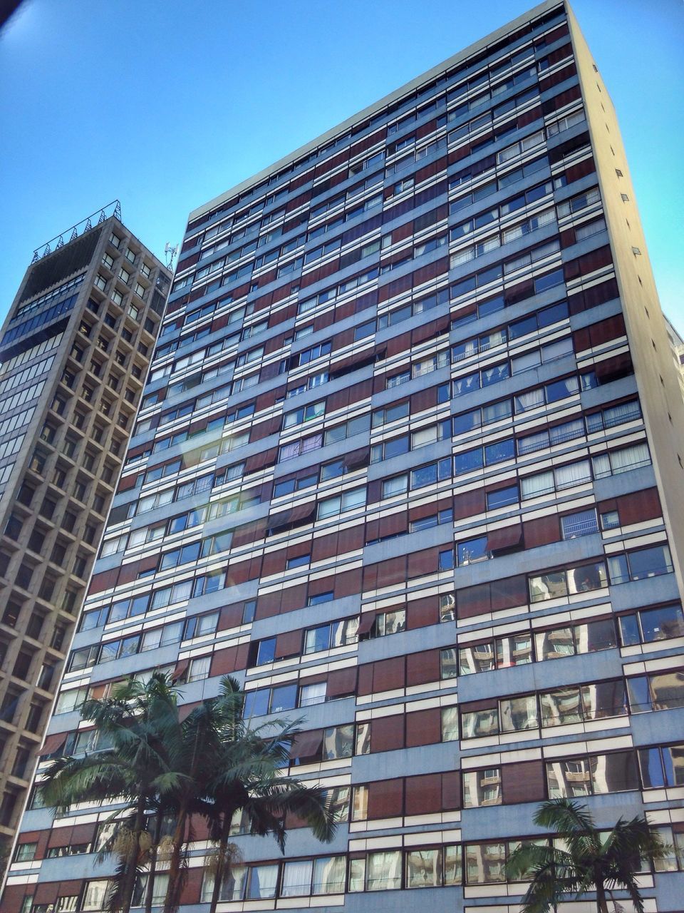 LOW ANGLE VIEW OF OFFICE BUILDING AGAINST SKY