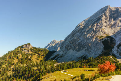 Scenic view of mountains against clear blue sky