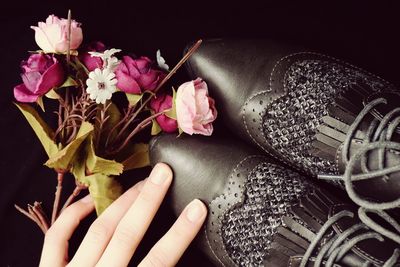 Close-up of hand holding flower