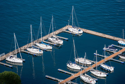 High angle view of sailboats moored in sea