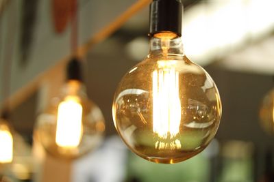 Close-up of illuminated light bulb