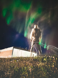 A man looking at the northern lights