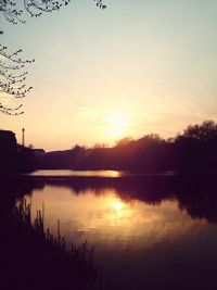 Scenic view of calm lake at sunset