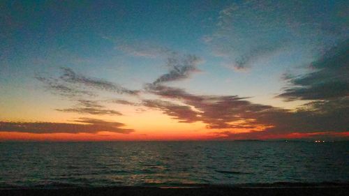 View of calm sea at sunset