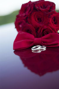 Close-up of red rose on table