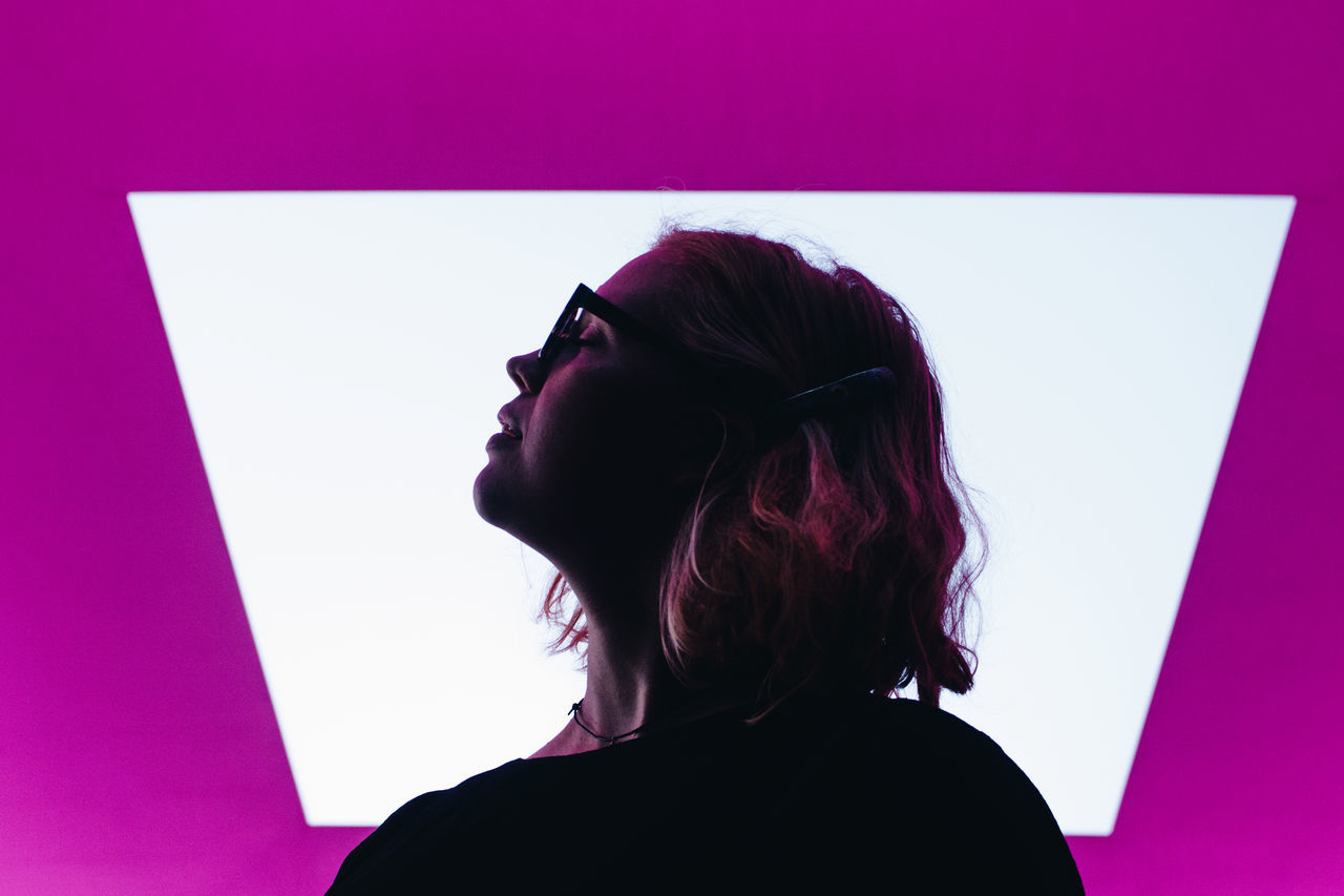 purple, one person, adult, headshot, violet, women, portrait, pink, indoors, hairstyle, young adult, magenta, long hair, side view, looking, silhouette, studio shot, glasses, human hair, contemplation, copy space, profile view