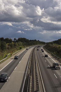 Cars on highway against sky