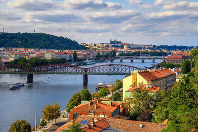 High angle view of river amidst buildings against sky