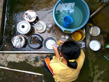 High angle view of man sitting on table