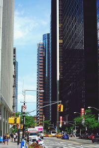 City street and modern buildings against sky