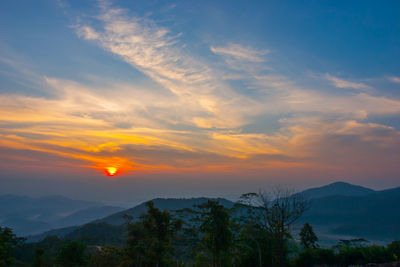 Scenic view of mountains against sky during sunset