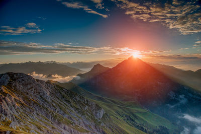 Scenic view of mountains against sky during sunset