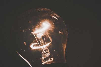 Close-up of illuminated light bulb