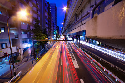 High angle view of light trails on road at night