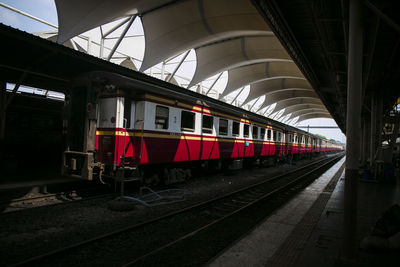 Train at railroad station against sky