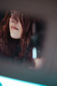 Portrait of a young woman looking away