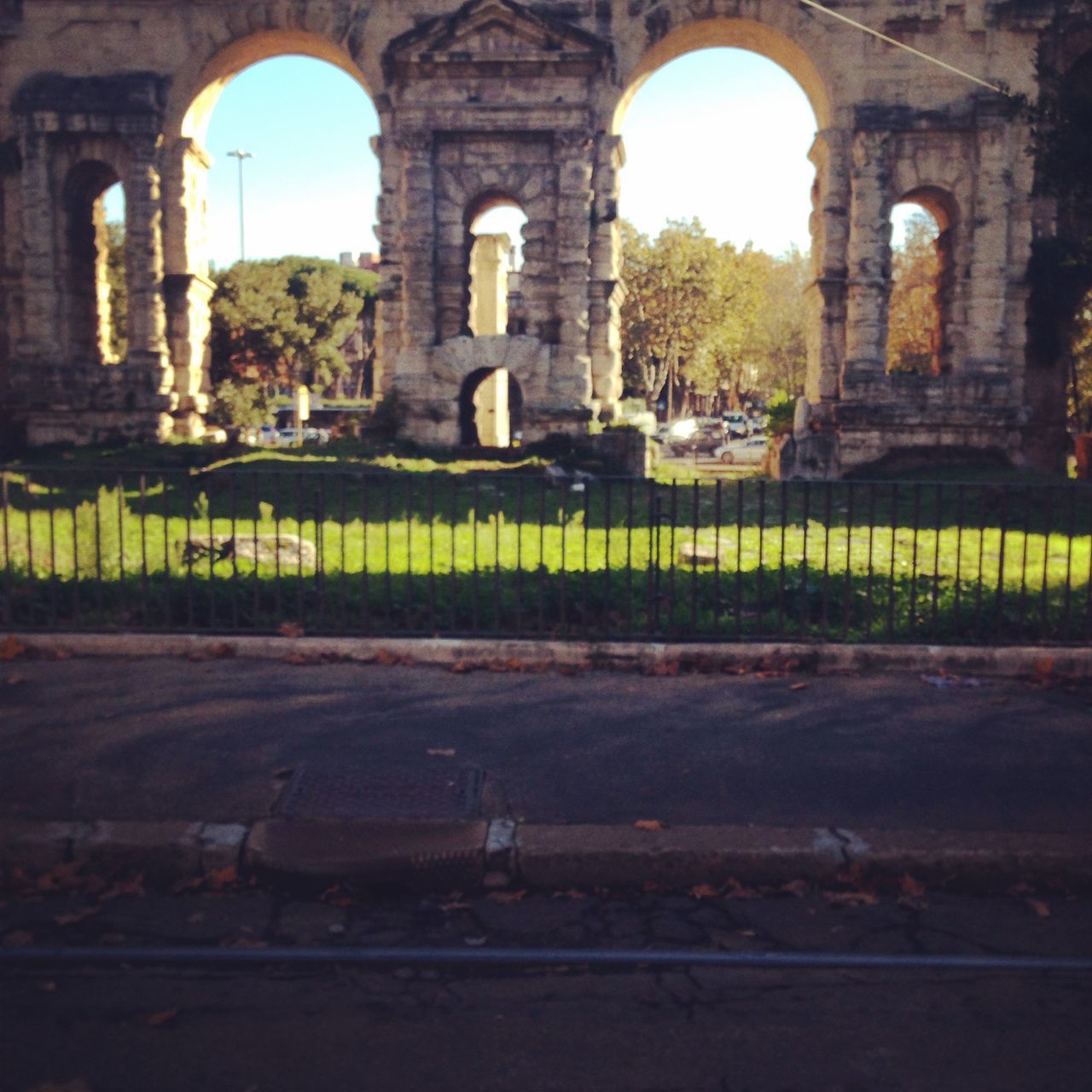 arch, architecture, built structure, building exterior, archway, history, old, architectural column, indoors, tree, old ruin, arched, the past, day, grass, no people, lawn, abandoned, building