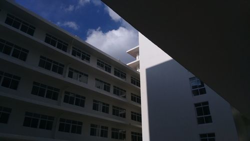 Low angle view of office building against sky