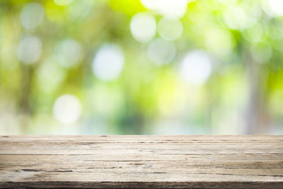 Close-up of wooden bench on table