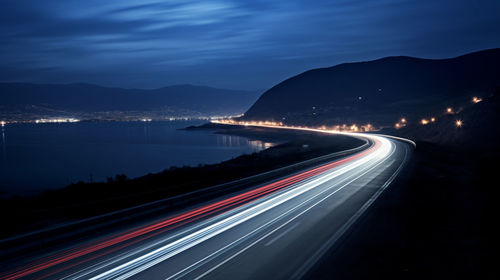 High angle view of light trails on highway at night