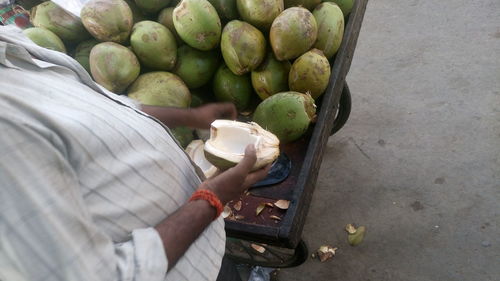 Cropped coconut vendor