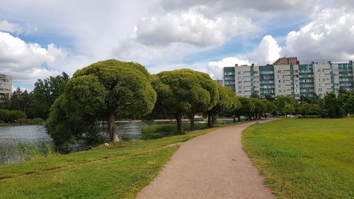 Panoramic view of trees and buildings against sky