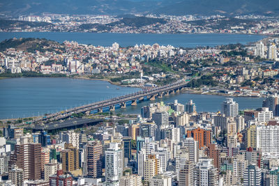 High angle view of city by sea
