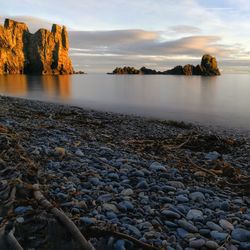 Scenic view of sea against sky at sunset