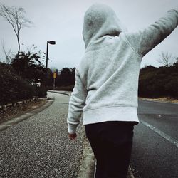 Woman standing on road