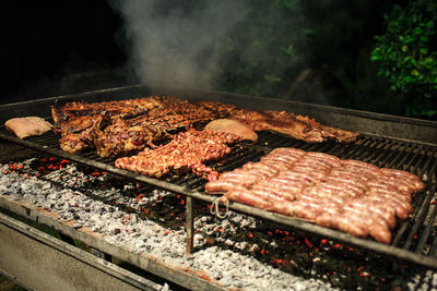 Close-up of meat on barbecue grill