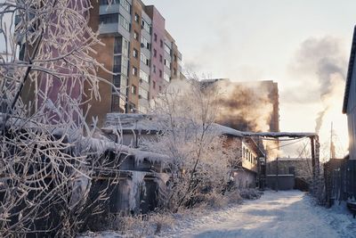 Buildings against sky during winter