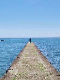 Scenic view of sea against clear blue sky