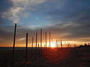 Scenic view of beach against sky during sunset