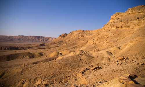 Scenic view of desert against clear sky