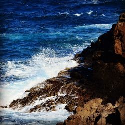 Waves splashing on rocks