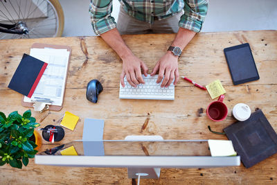 High angle view of man working on table