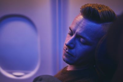 Man sleeping in airplane
