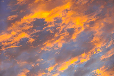 Low angle view of dramatic sky during sunset